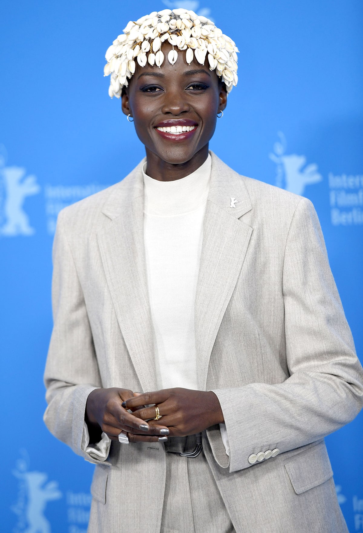 BIFF Jury President Lupita Nyong'o accessorizes with a cowrie shell headpiece by Lafalaise Dion