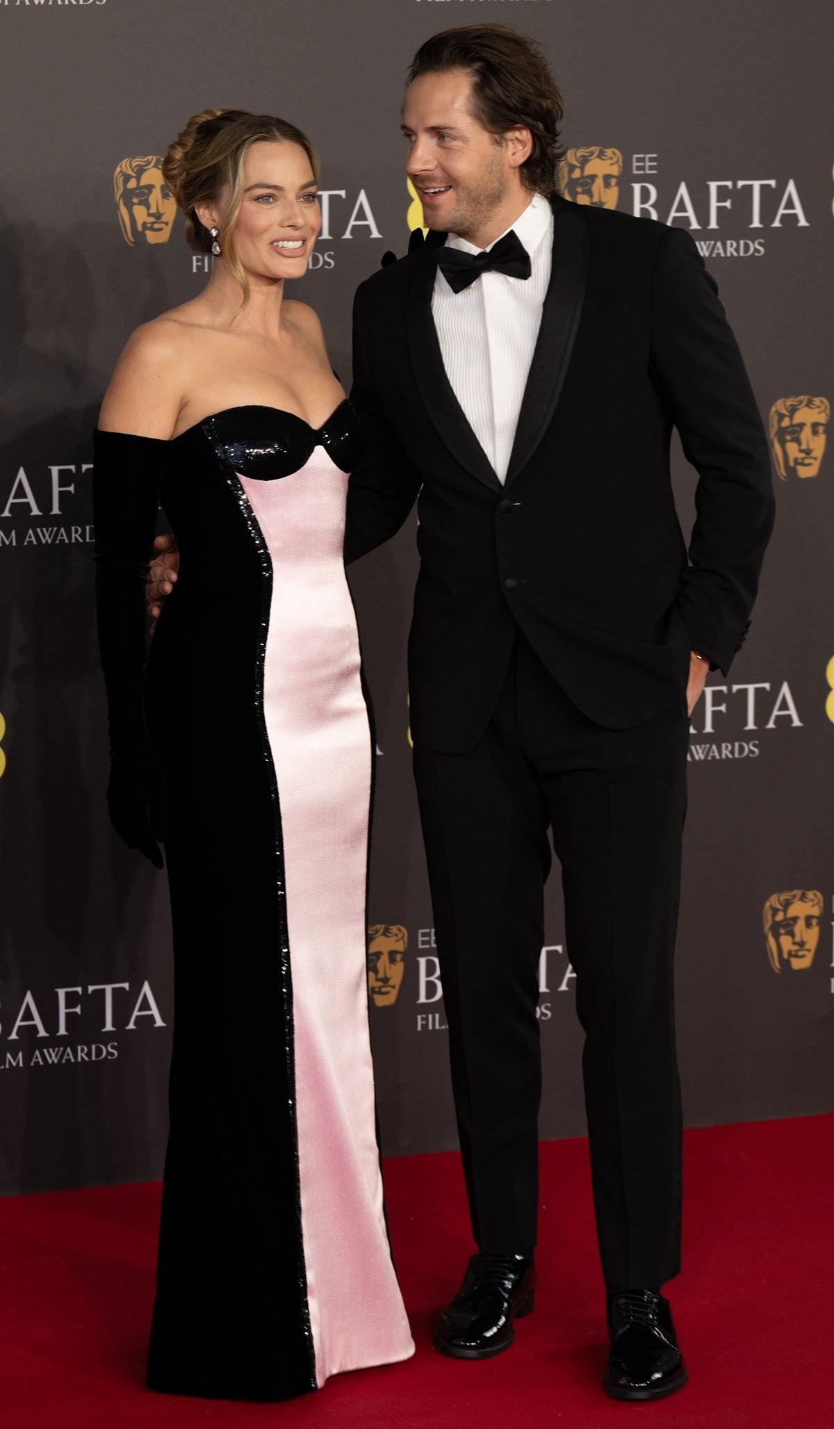 Margot Robbie and Tom Ackerley attend the 2024 EE BAFTA Film Awards at The Royal Festival Hall on February 18, 2024 in London, England
