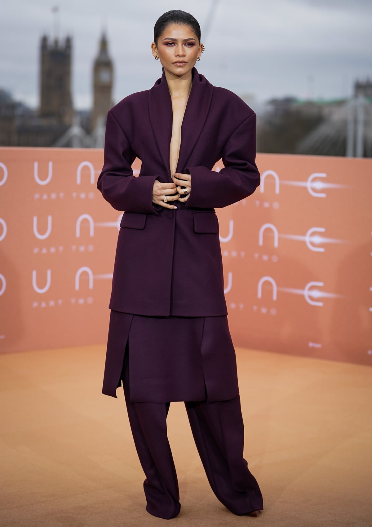 Zendaya exudes confidence and style in a deep purple, three-piece suit by Roksanda at the London photocall for "Dune: Part Two"