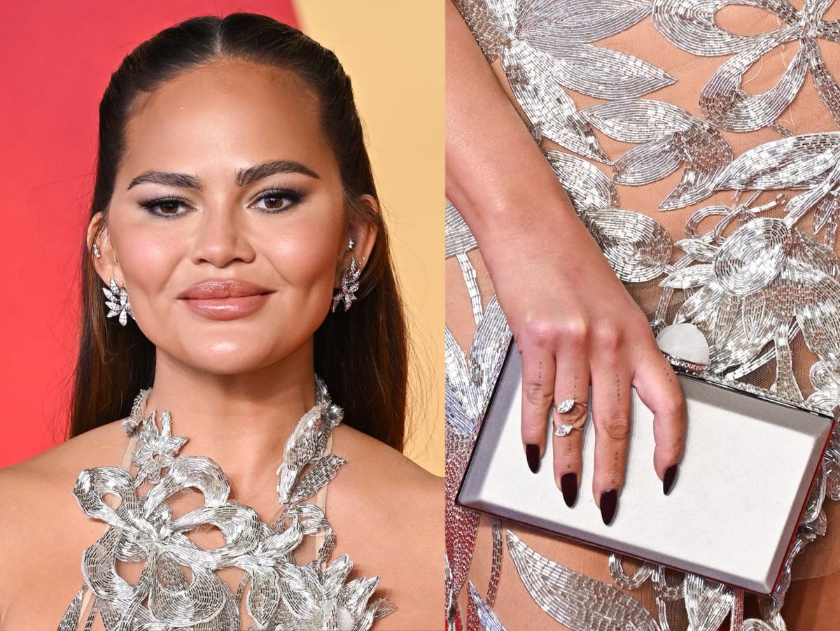 Chrissy Teigen accessorizes her silver gown with Lorraine Schwartz diamond jewelry and silver Judith Leiber Skylar clutch