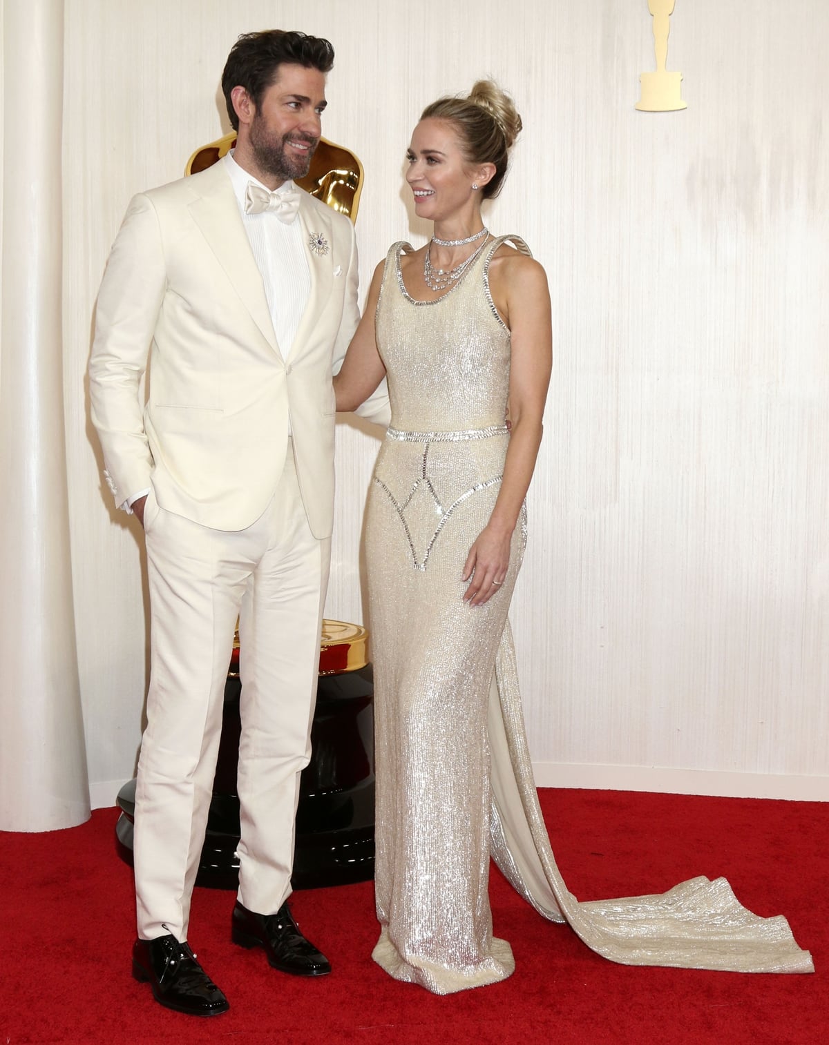 Emily Blunt Radiates in Gold Schiaparelli Gown With Husband John