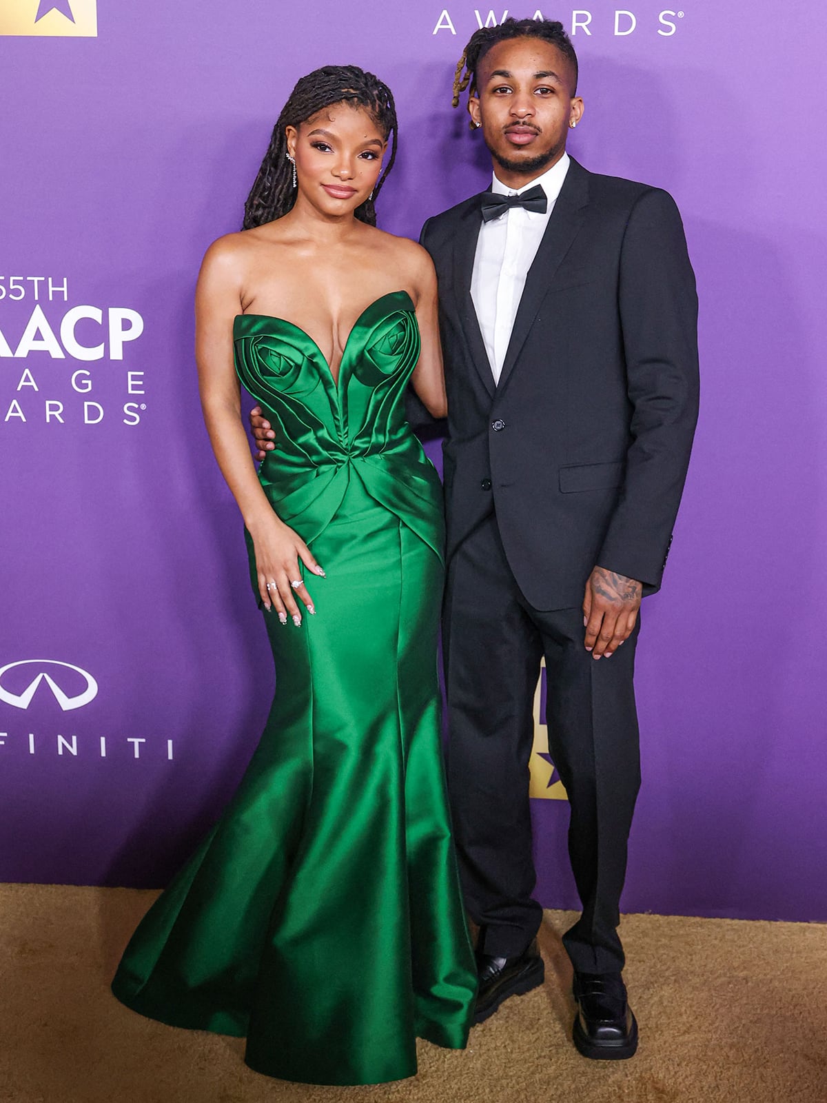 Halle Bailey with her baby daddy DDG clad in a classic suit with a bowtie at the 2024 NAACP Image Awards