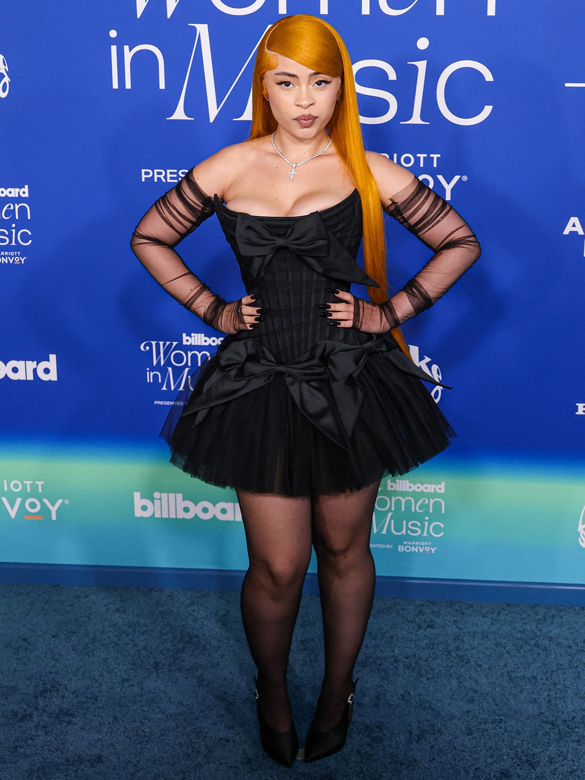 Ice Spice channels a coquette goth girl in a black Wiederhoeft bow-embellished LBD at the 2024 Billboard Women in Music Award held at the YouTube Theater at SoFi Stadium in Inglewood, Los Angeles, California on March 6, 2024