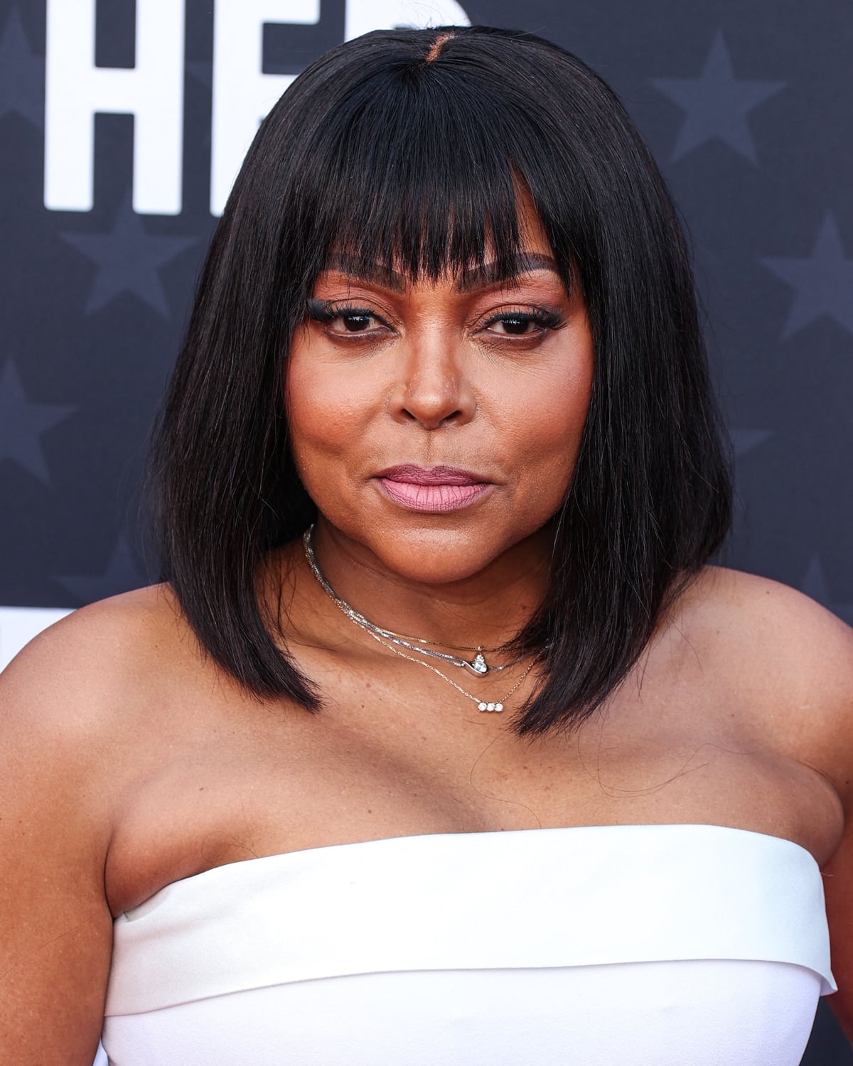 Taraji P. Henson's short black hair with a fringe and subtle makeup highlights her natural beauty