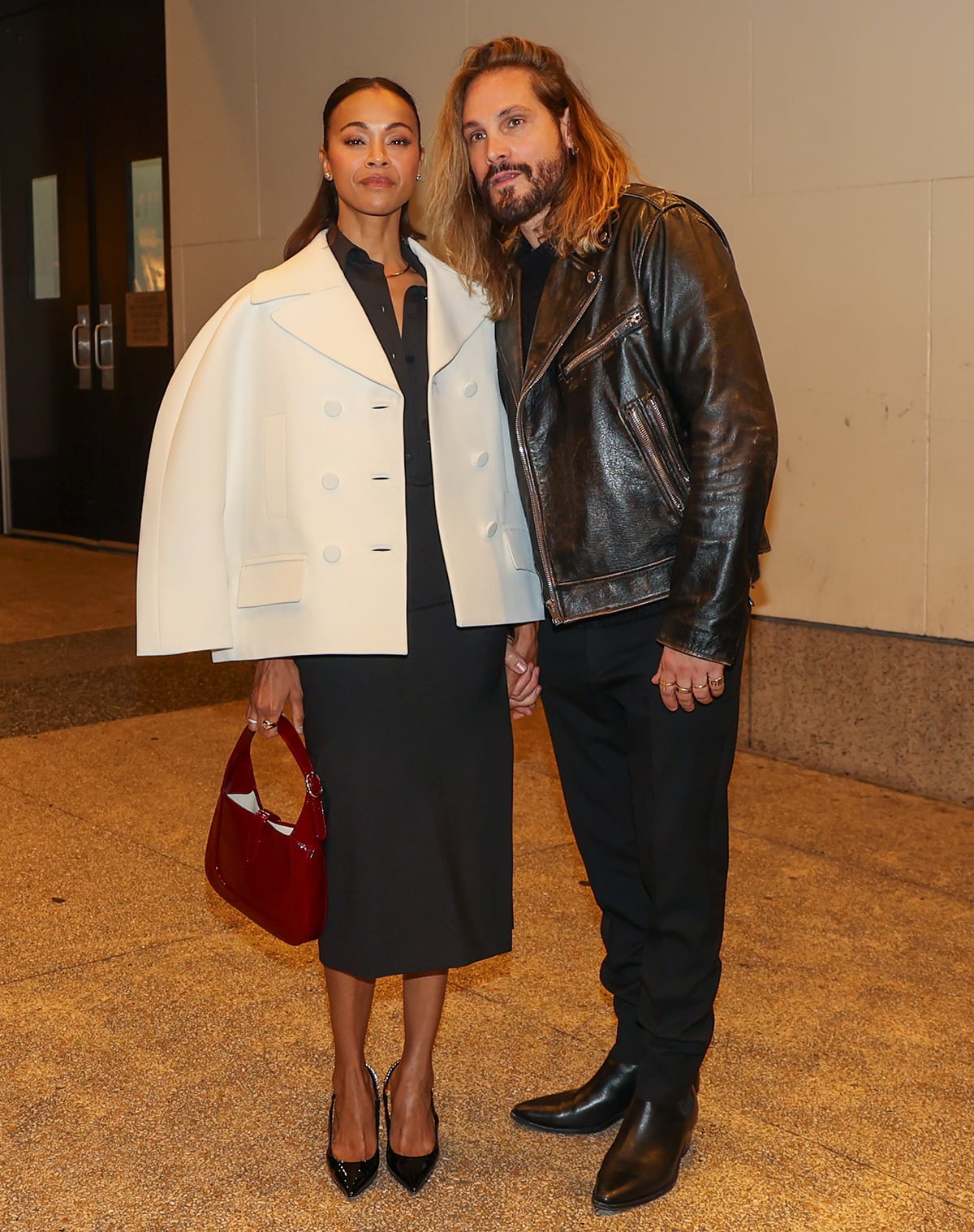 Zoe Saldana with Marco Perego at The View studios to discuss The Absence of Eden dressed in a black Gucci shirt dress with a white Gucci jacket