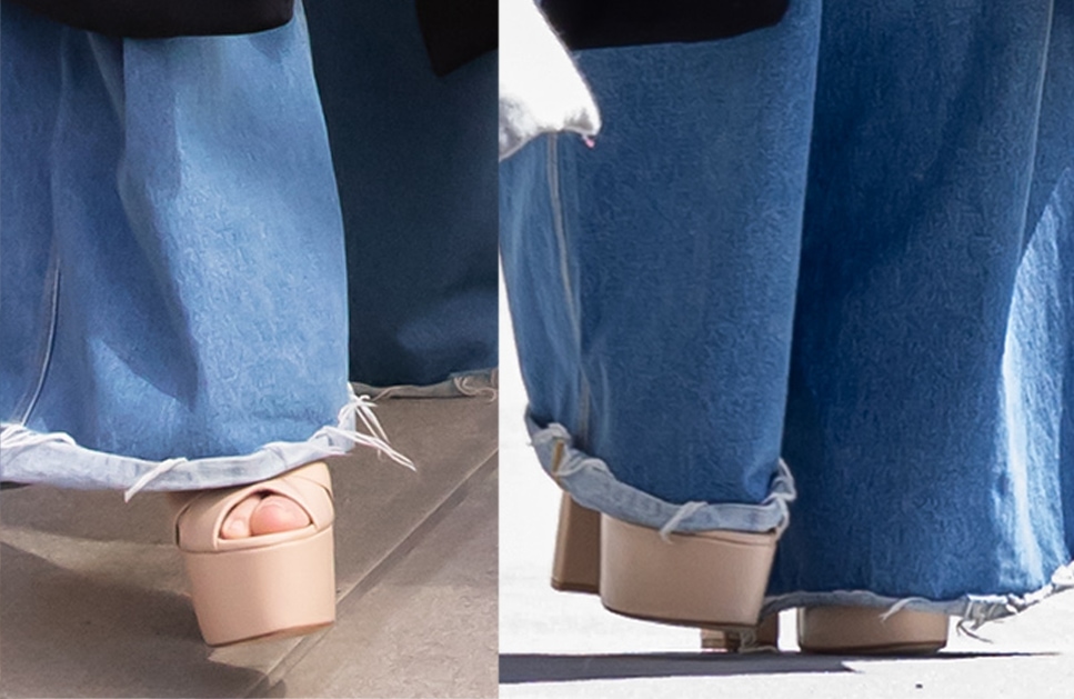 Jennifer Lopez's nude platform sandals, hidden beneath her wide-leg jeans, have peep toes, crossover straps, and high block heels