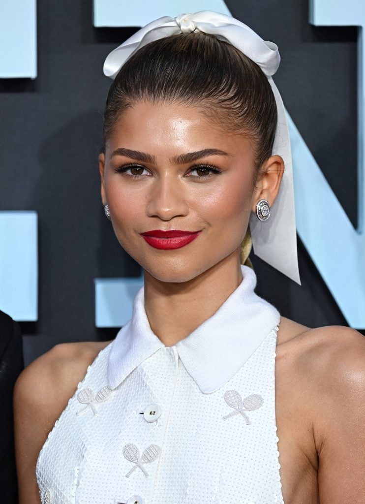 Zendaya Debuts Blonde Bangs and Long Braids in Feathered Tail Mini ...