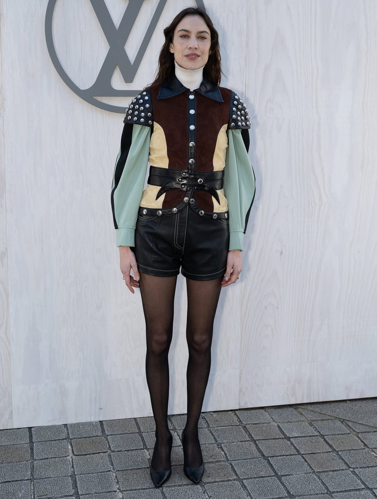 Alexa Chung dazzled at the Louis Vuitton show on March 5, 2024, wearing a Louis Vuitton Resort 2018 outfit paired with Louis Vuitton Sparkle pumps