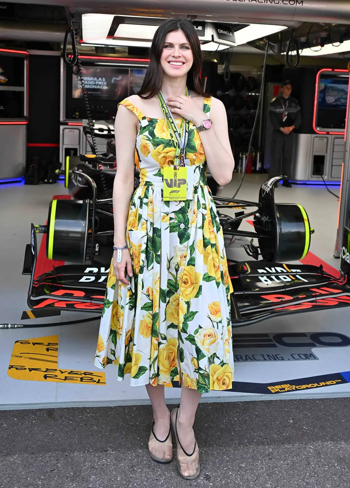 Alexandra Daddario stands out in a pretty white and yellow floral midi dress by Dolce & Gabbana at the Monaco F1 Grand Prix