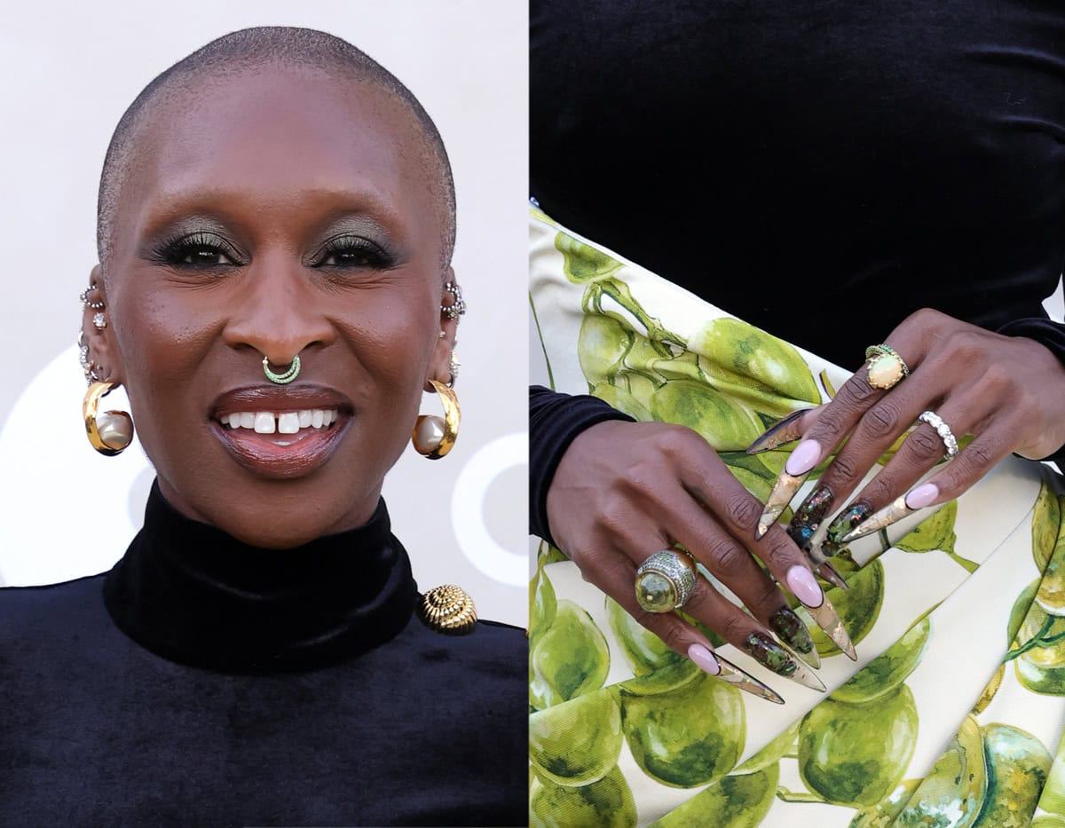 Cynthia Erivo styles her busy ensemble with statement rings and earrings, including a pair of hammered gold hoops with a pearl accent