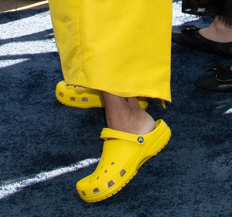 Brooke Shields pairs her yellow dress with yellow Crocs Classic Clogs following a “double foot toe surgery”