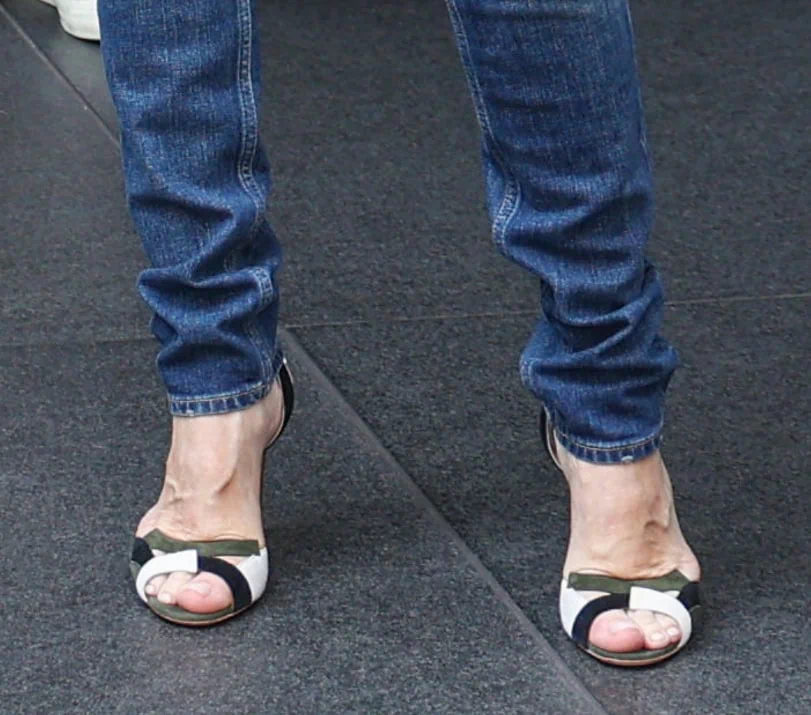 Celine Dion elevates her relaxed outfit with Gianvito Rossi patchwork sandals in green, black, and white