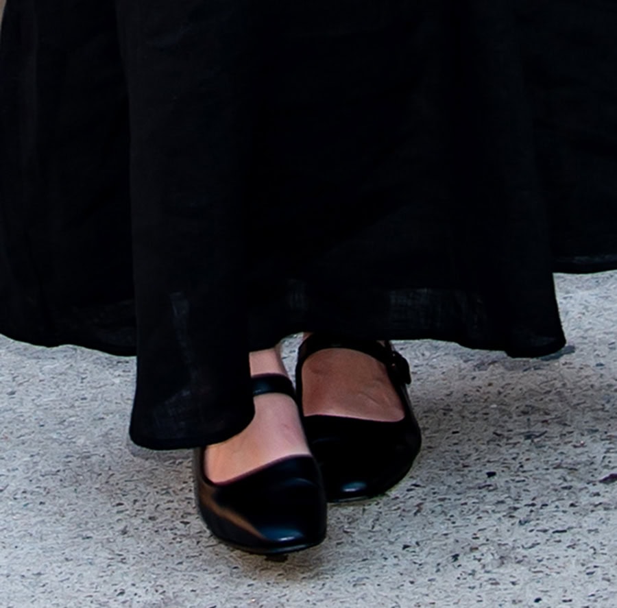 Dakota Fanning adds retro flair to her feminine dress with black The Row Ava Mary Jane ballet flats