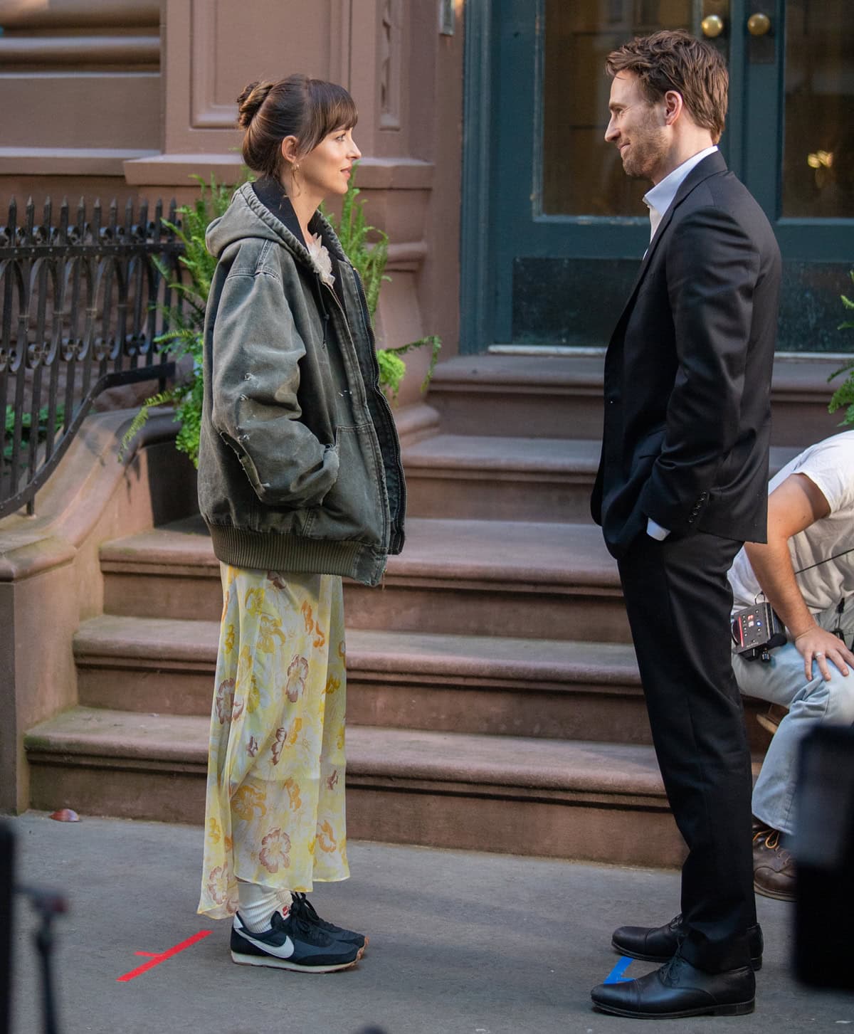 Dakota Johnson (L) and Chris Evans are seen filming the "Materialists" in the West Village on May 31, 2024, in New York City