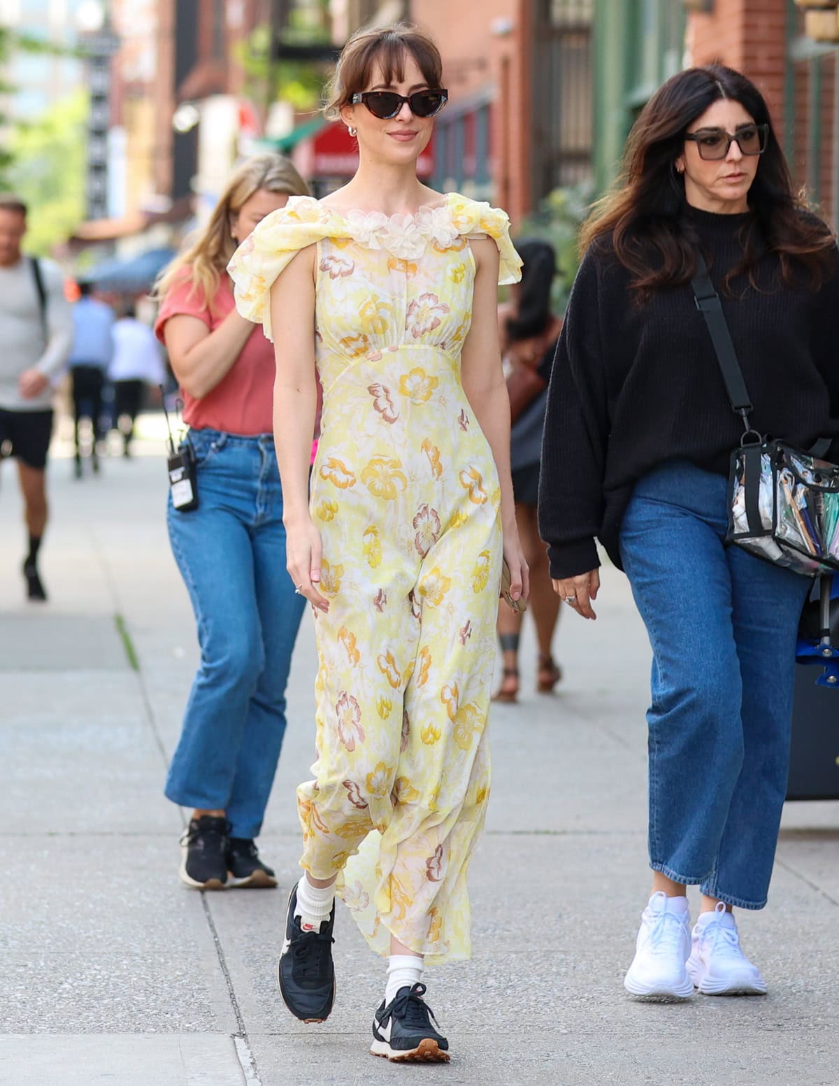 Dakota Johnson radiates summer vibes in her stunning Doen Nevara dress while filming on the set of 'Materialists'