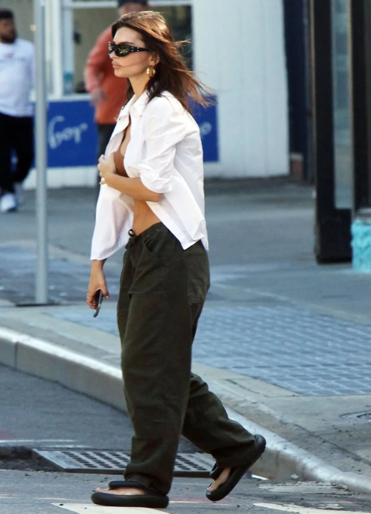 Emily Ratajkowski pairs a daring top with slouchy parachute pants for an effortlessly cool NYC stroll