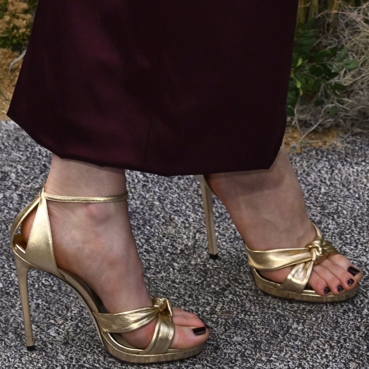 Jodie Comer flaunts her chic pedicure and height-boosting gold Jimmy Choo Rosie heels