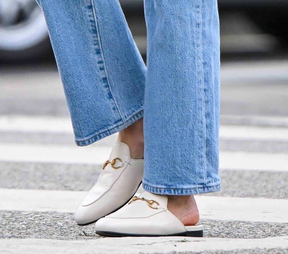 Lucy Hale wears the iconic, celebrity-favorite Gucci Princetown mules in white leather