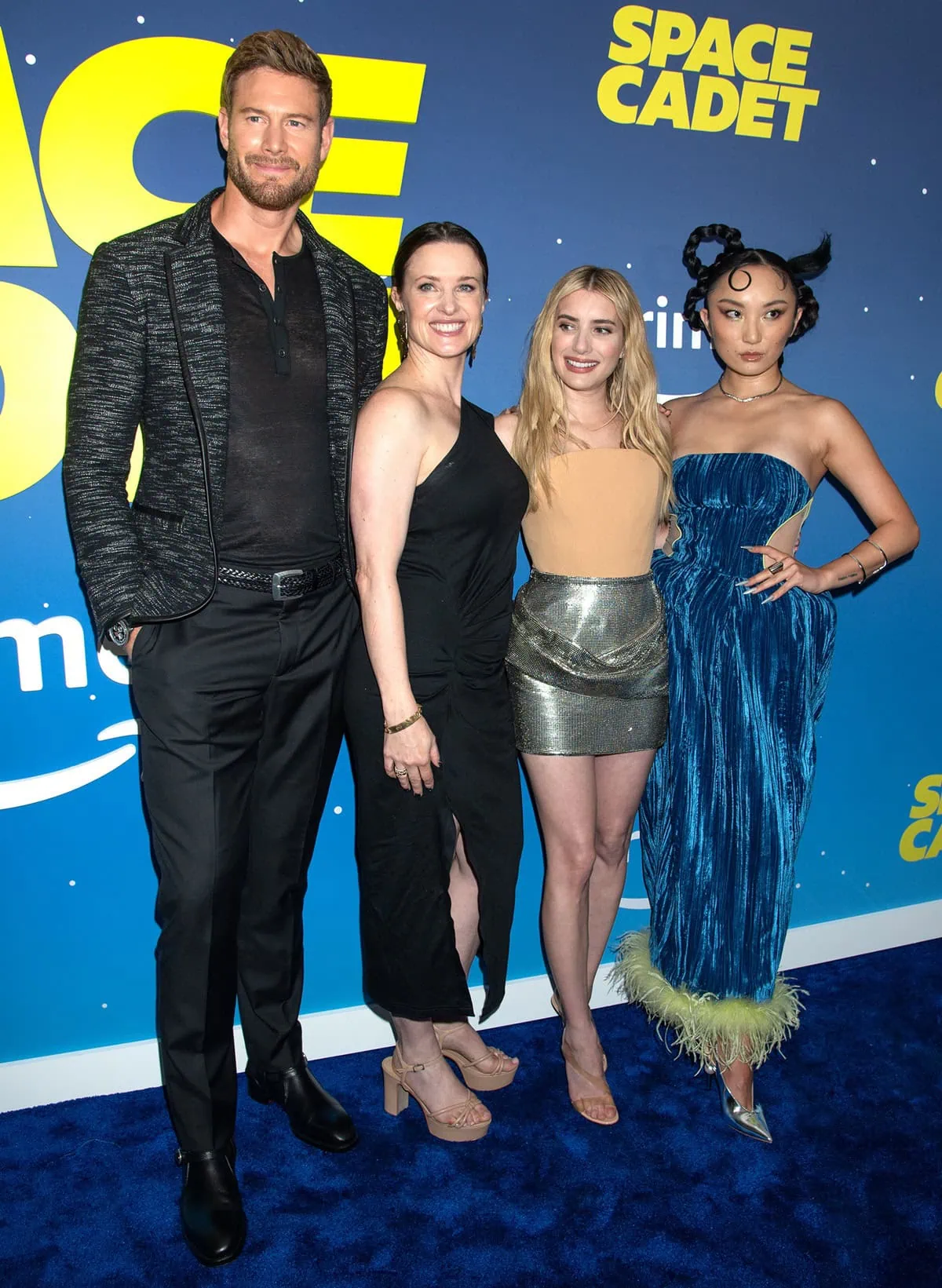 Tom Hopper, towering at 6'5" (196 cm), makes quite the impression alongside Liz Garcia, Emma Roberts, and Poppy Liu at the Space Cadet premiere