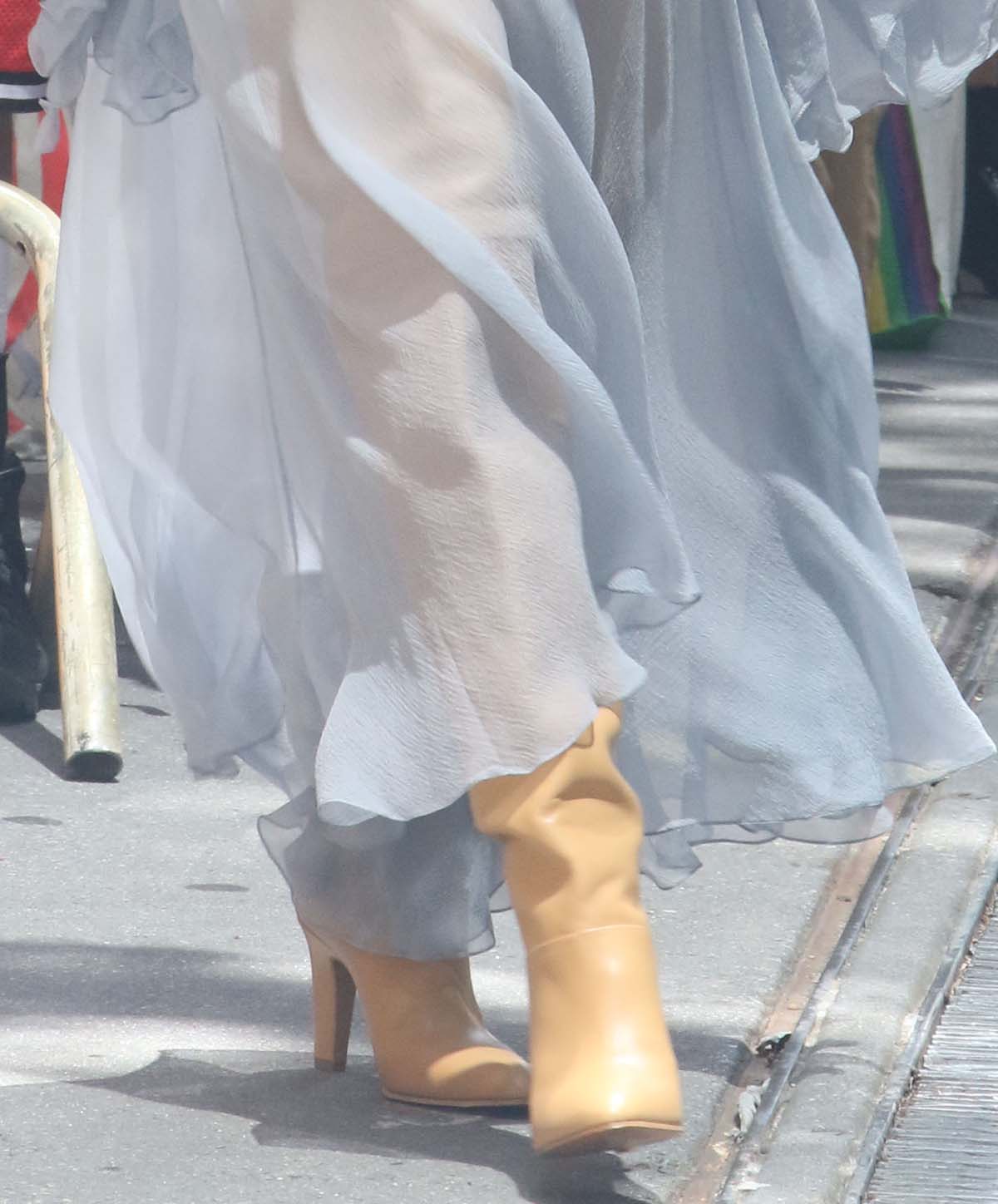 Daisy Edgar-Jones pairs her blue sheer bohemian dress with tan over-the-knee Chloe boots