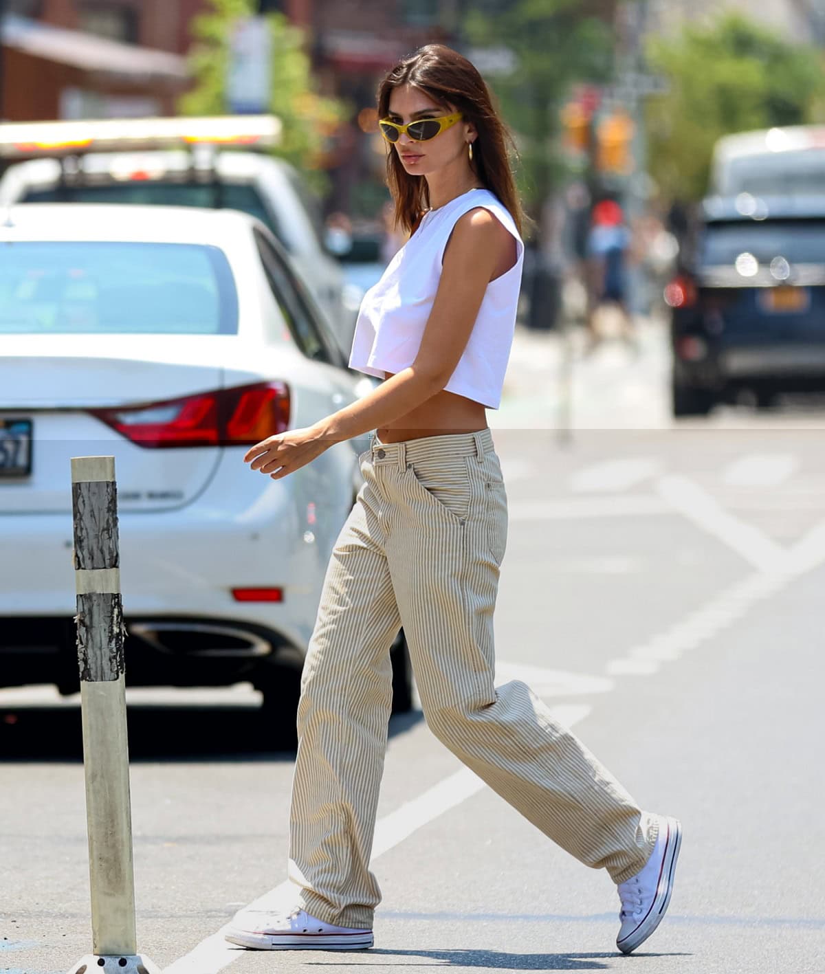 Emily Ratajkowski masters Parisian chic with Levi's Dad Utility pants and classic Converse sneakers