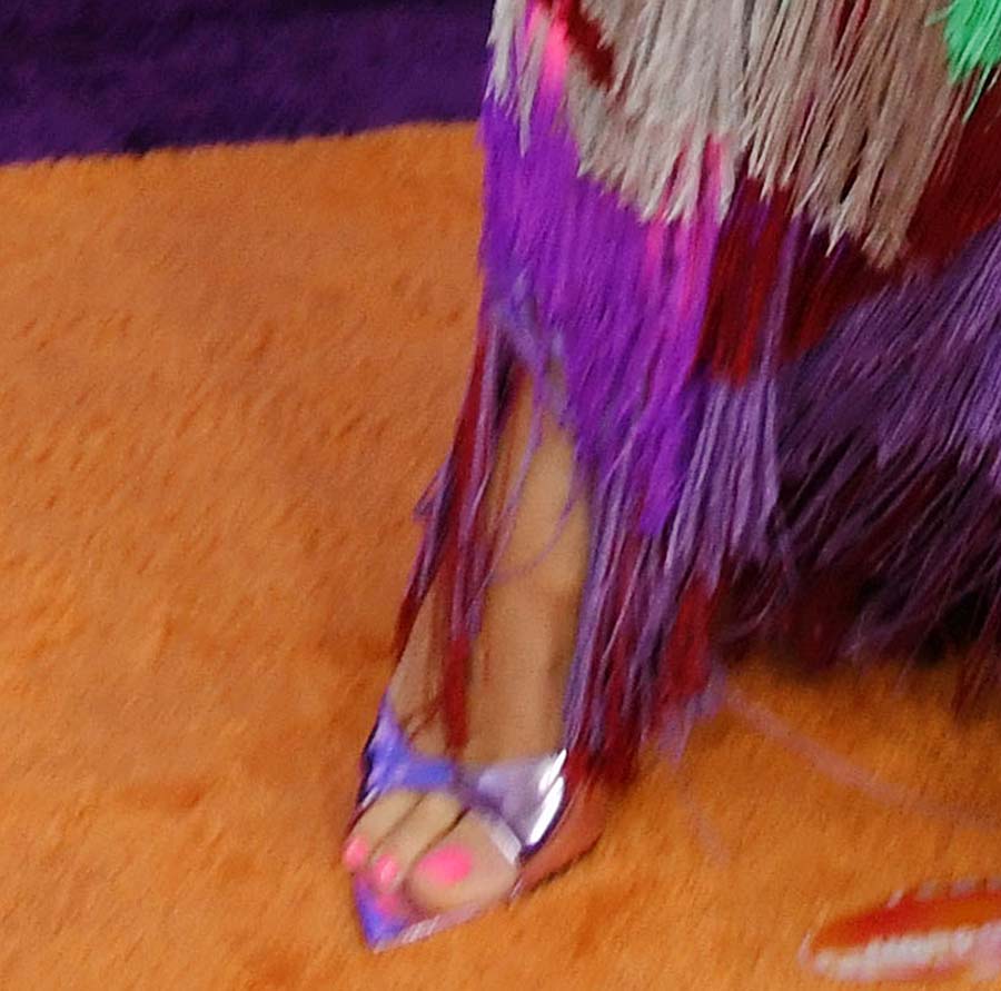 Heidi Klum teams her rainbow-colored tassel dress with metallic dirty mauve mules by Black Suede Studio