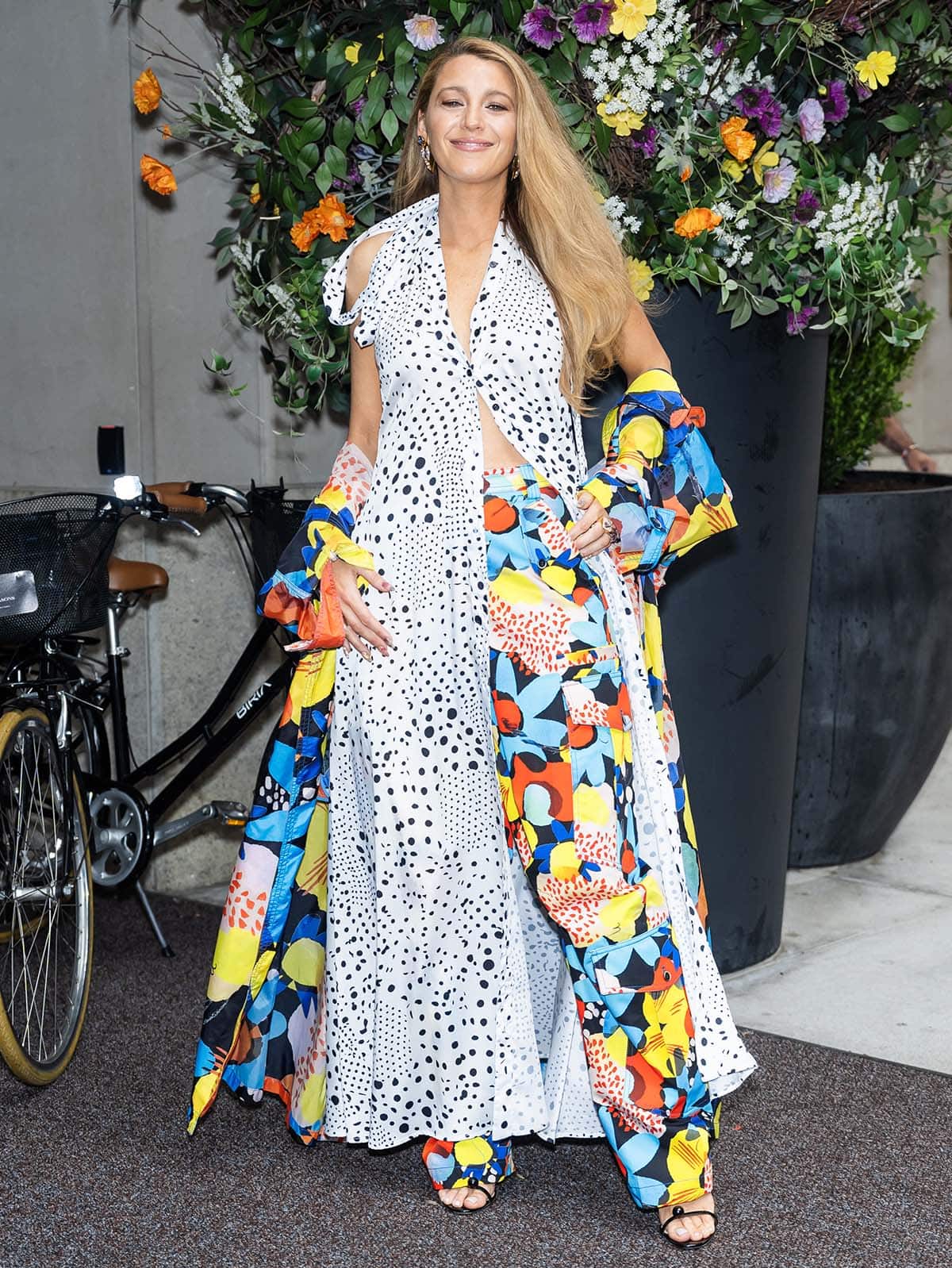 Blake Lively gets playful in Christopher John Rogers' polka-dot halter maxi dress and floral jacket and pants combo