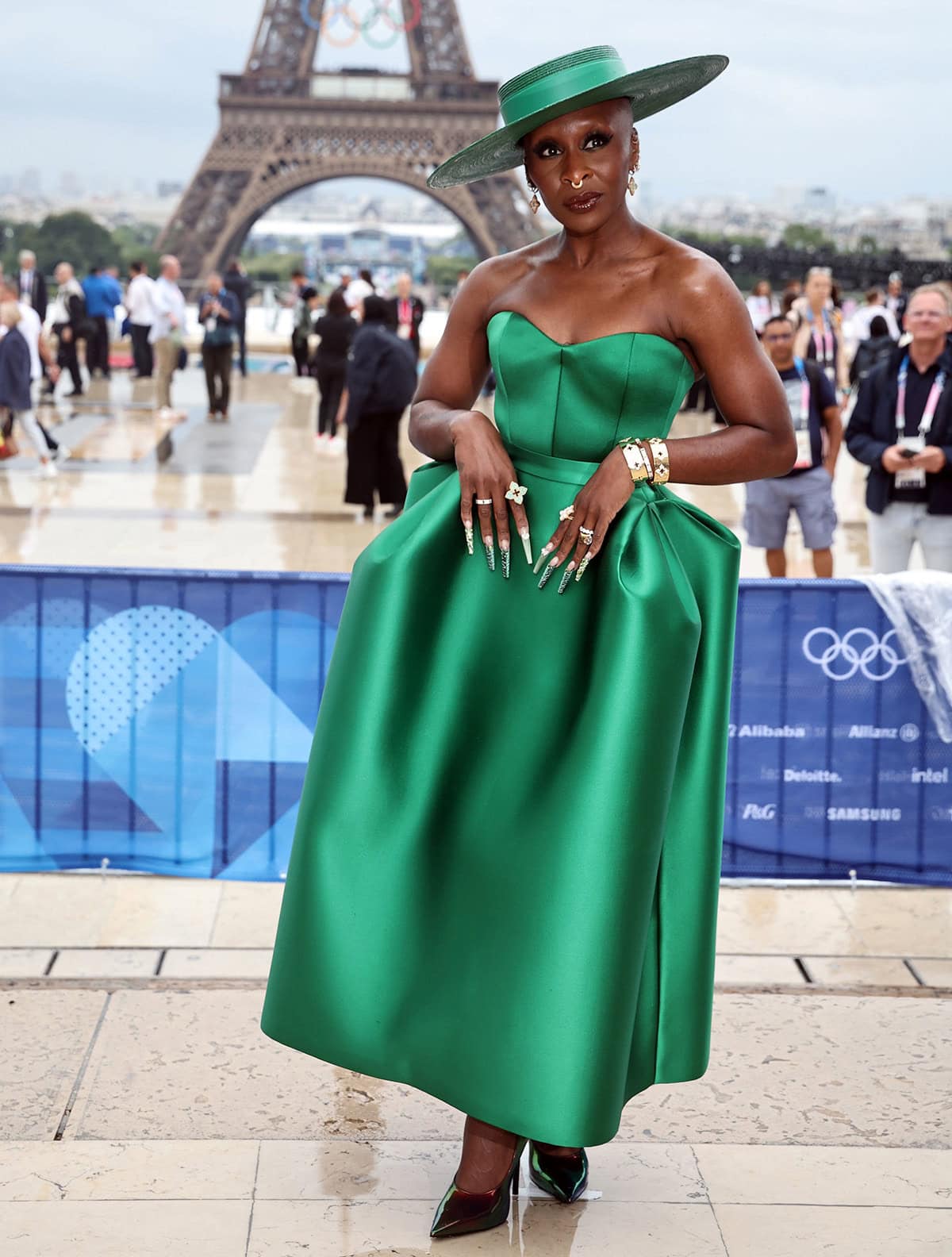 Cynthia Erivo channels Wicked's Elphaba in a green Louis Vuitton strapless gown with a pannier waist and a matching wide-brimmed chapeau at the 2024 Olympics opening ceremony