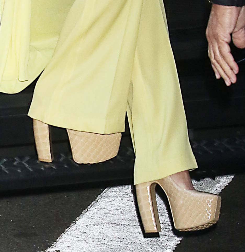 Julianne Hough teams her bright yellow outfit with nude croc-embossed Mary Jane platform pumps by Bottega Veneta