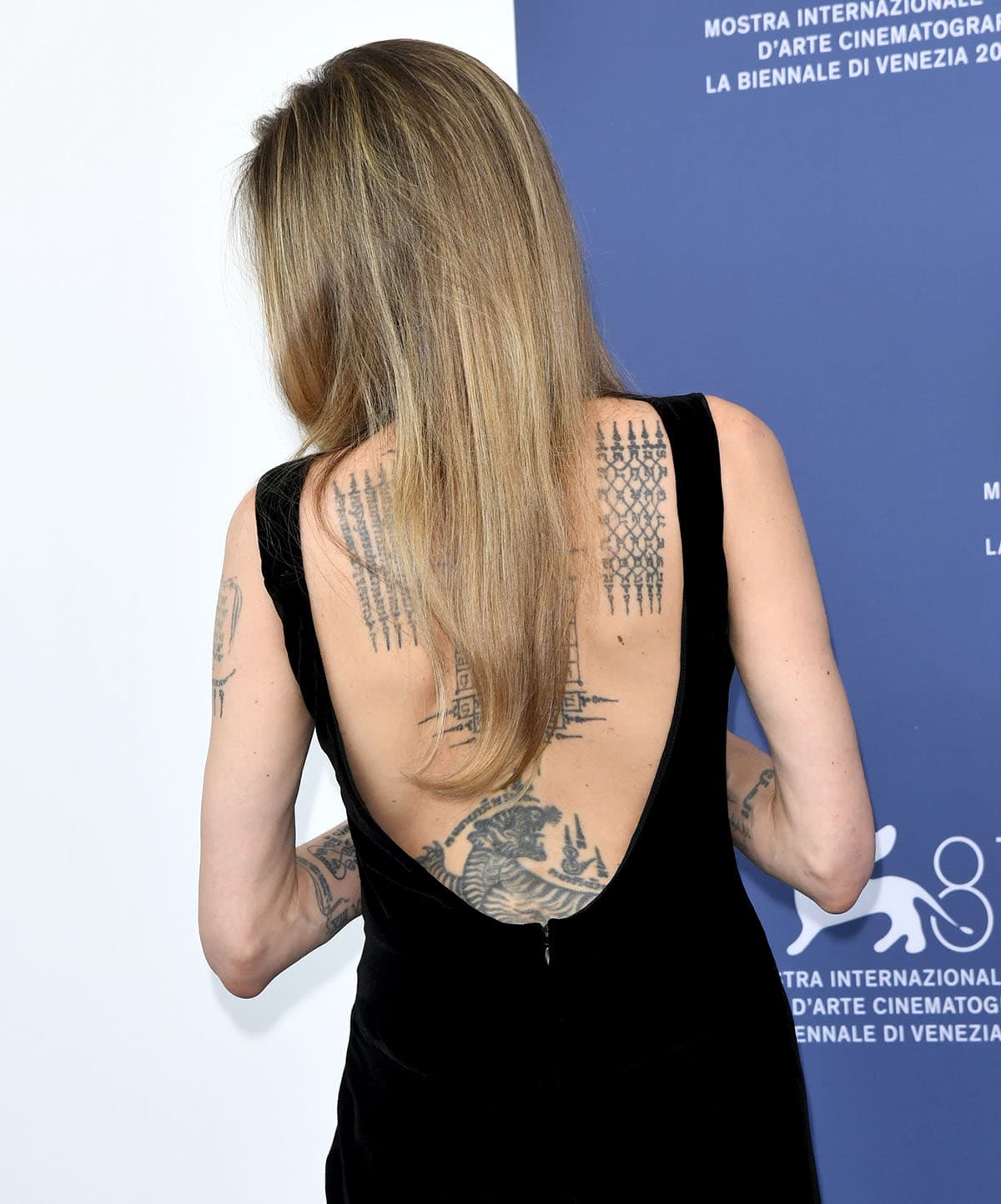 Angelina Jolie's dress has a scoop back that allows her to show off her Sak Yant tattoo collection