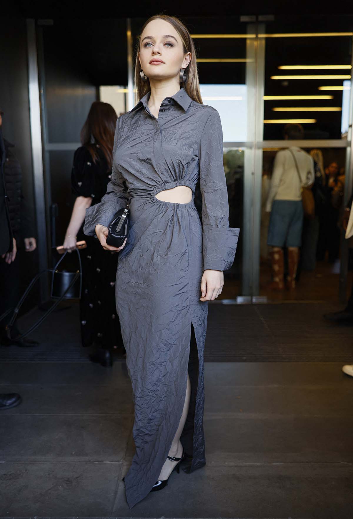 Joey King receives the Women in Film Max Mara Face of the Future Award in a gray Max Mara collared, long-sleeved ruched dress, embracing corpcore aesthetic