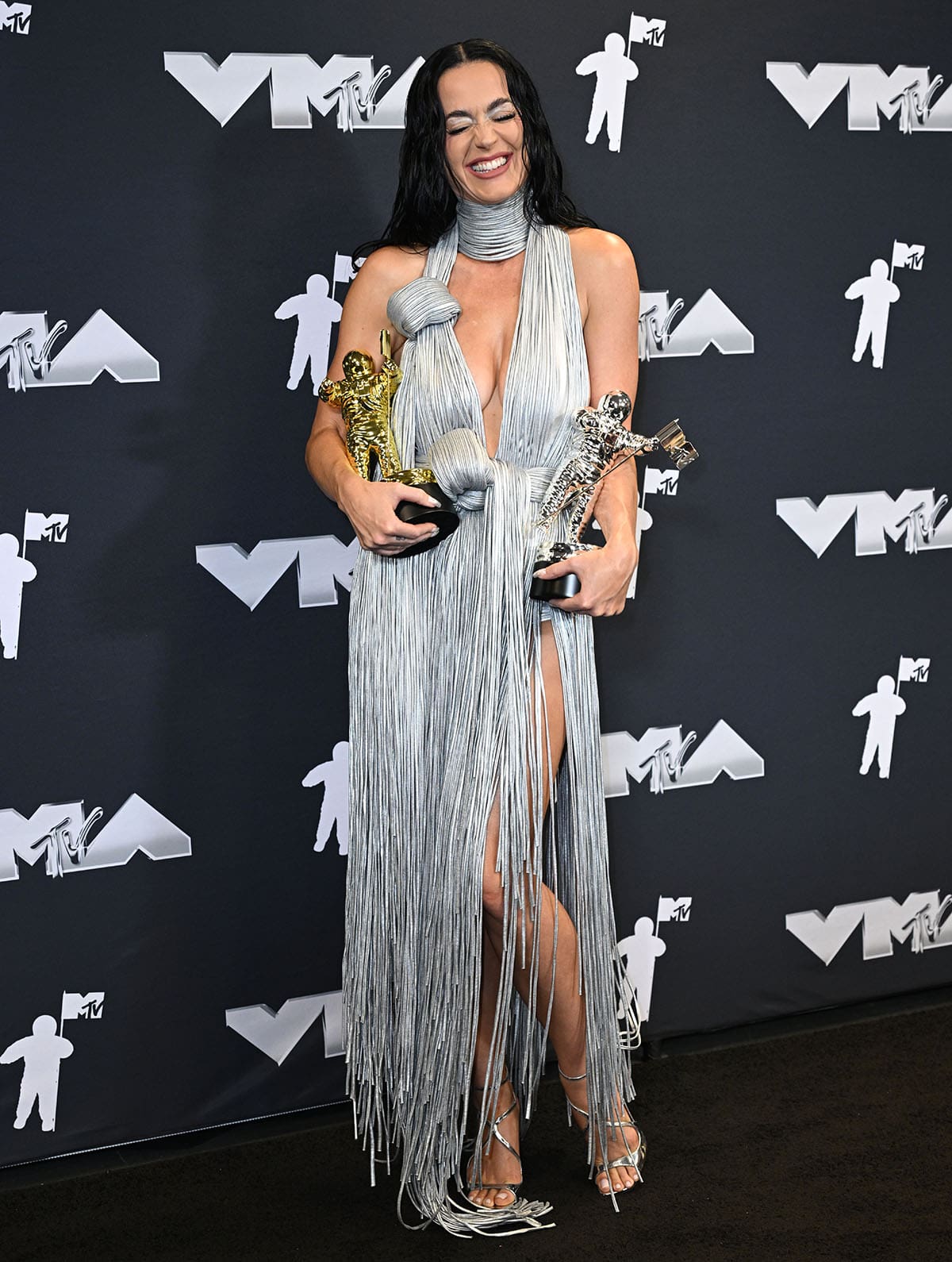 Katy Perry takes to the stage in a silver Area fringe dress to receive the Michael Jackson Video Vanguard Award and the Moon Person for Most Iconic Performance