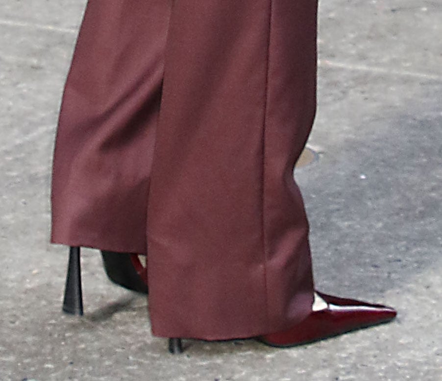 Lily Collins pairs her merlot blazer and pants with matching pumps for a seamless finish