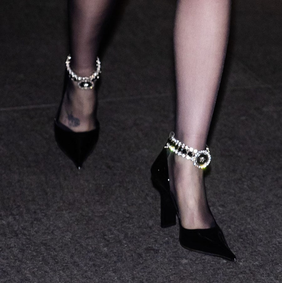 Lily Collins teams her sultry LBD with Versace Slice d'Orsay pumps featuring bejeweled ankle straps