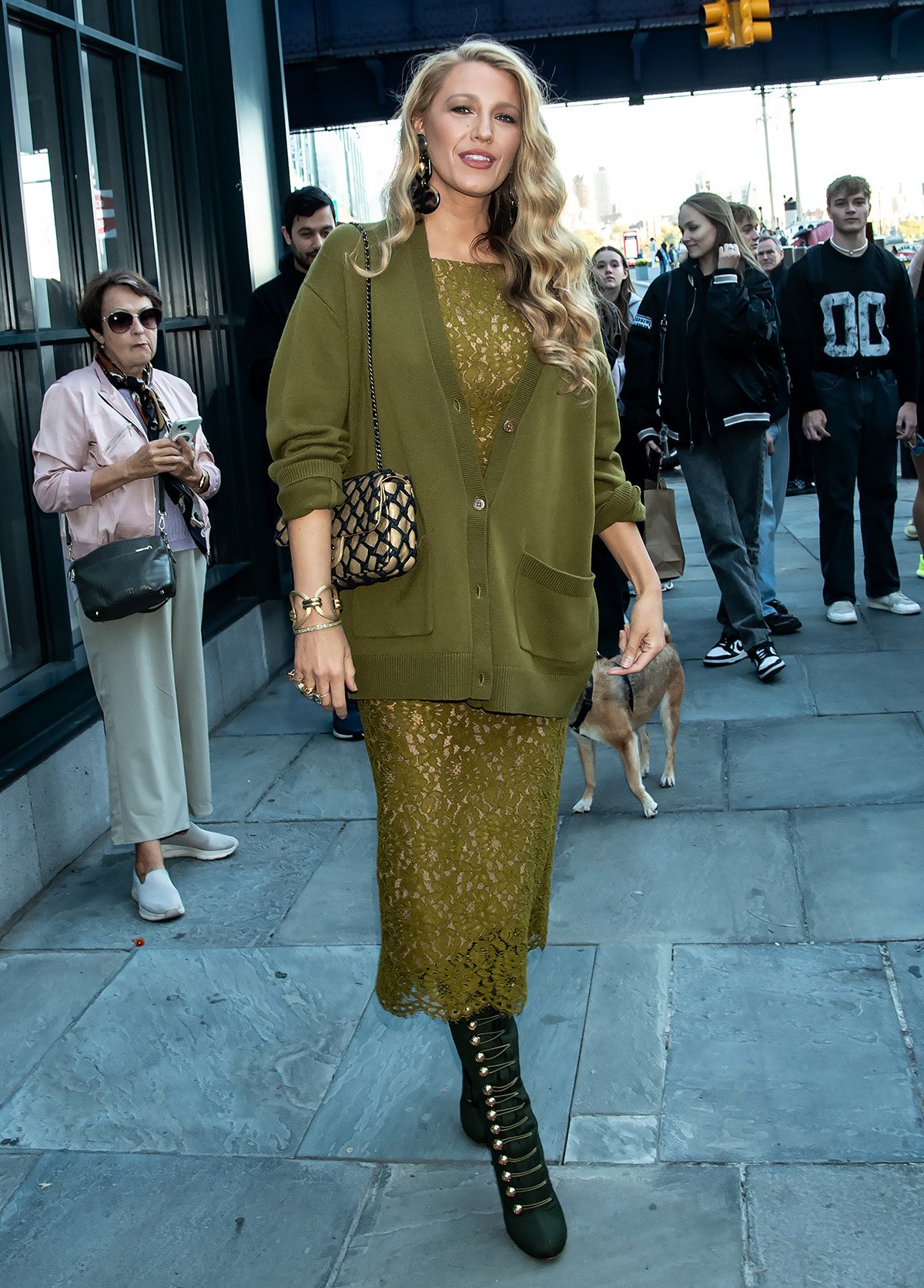 Blake Lively embraces fall's green hue in a Michael Kors chartreuse lace midi dress and a slouchy green cardigan