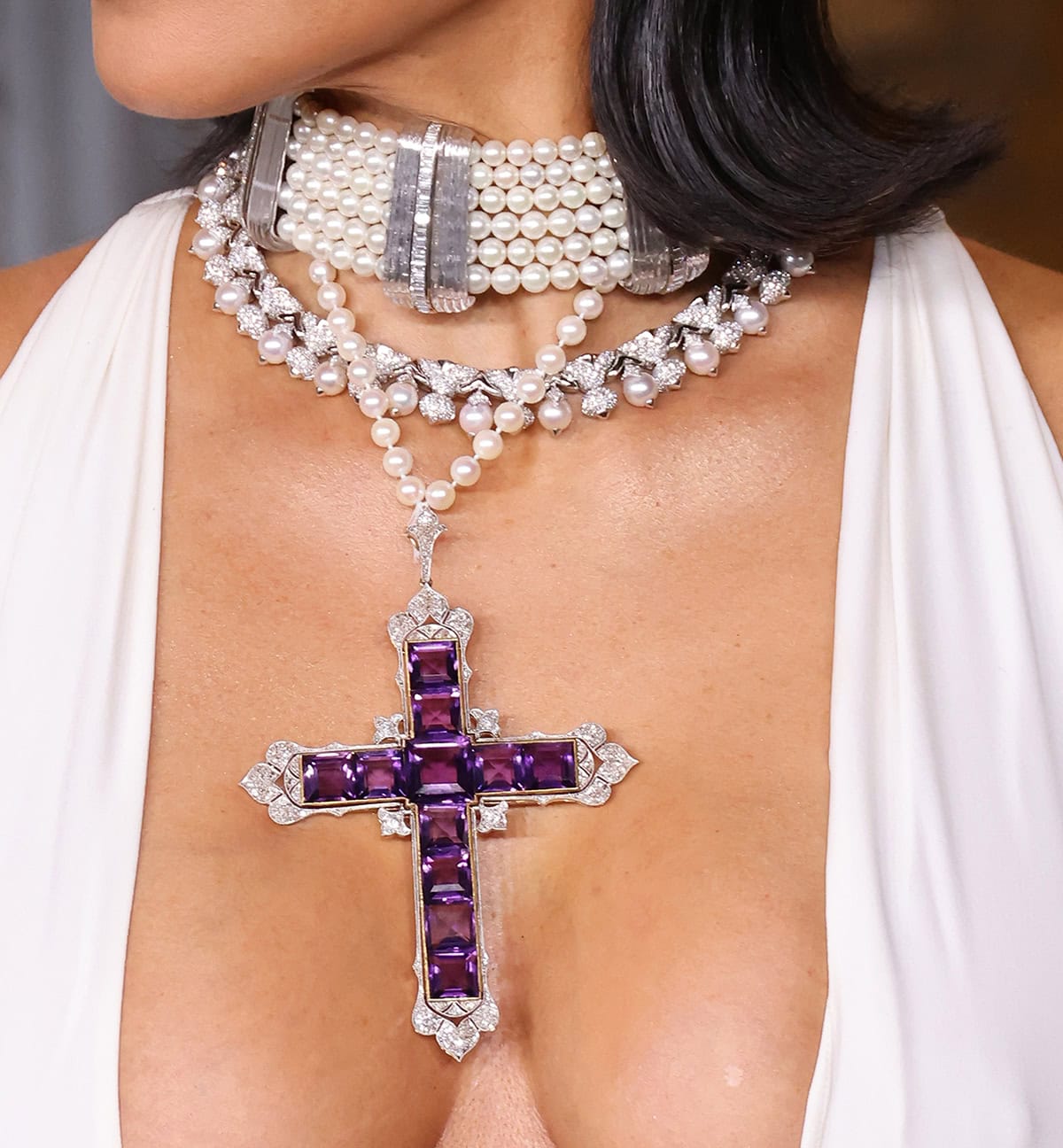 Kim Kardashian accessorizes her white ensemble with the Amethyst Attallah Cross Pendant Necklace worn by Princess Diana in 1987