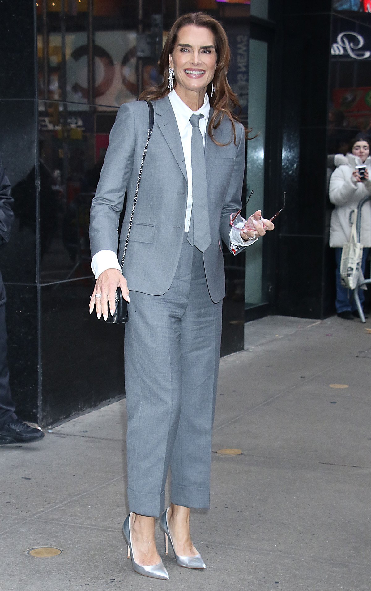 Brooke Shields power dresses in a gray suit and silver pumps to promote her new book, Brooke Shields Is Not Allowed to Get Old, at the Good Morning America studios