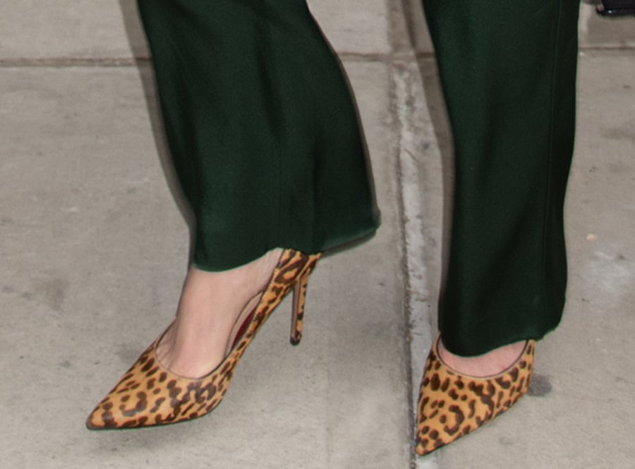 Julia Stiles teams her green co-ords with pointy leopard-print pumps, enhancing the ensemble's flair