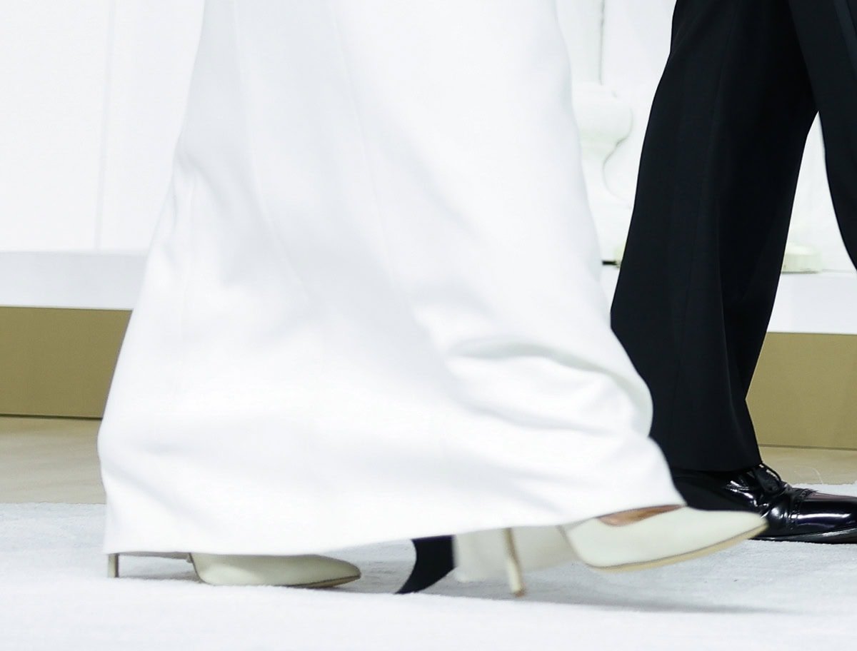 Melania Trump completes her clean and sophisticated white look with white leather Manolo Blahnik BB pumps