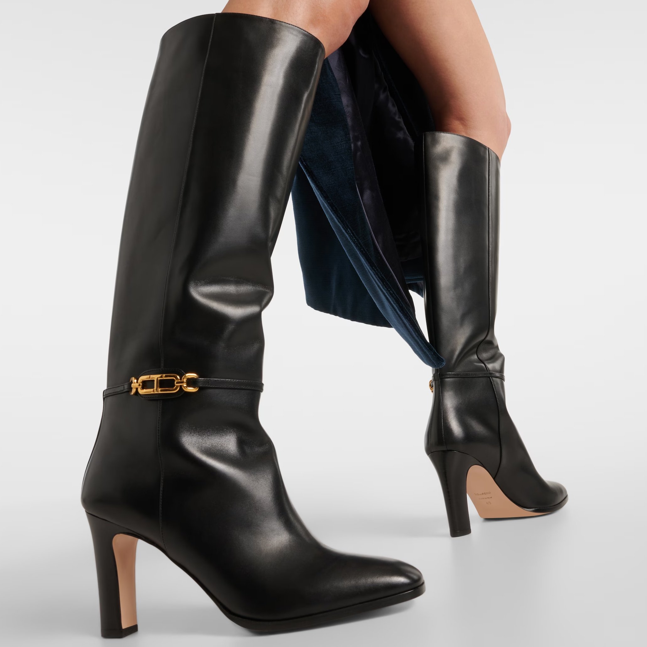 Keke Palmer's timeless Tom Ford Whitney leather knee-high boots feature iconic gold-tone T hardware for a chic, winter-ready look