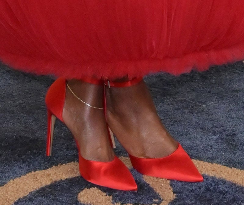 Danielle Deadwyler stands out in red satin d'Orsay pumps with ankle straps and high heels from Louis Vuitton