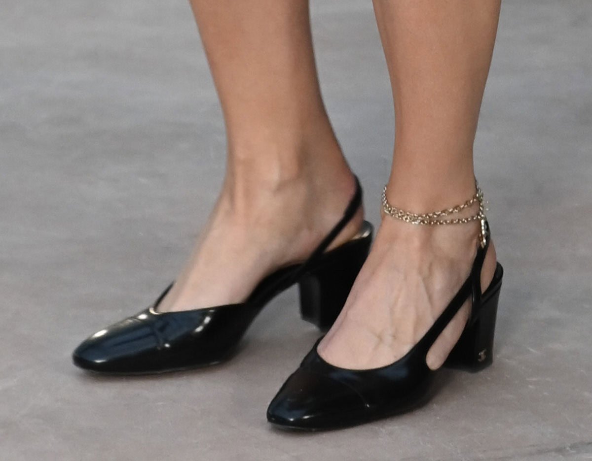 Kylie Jenner completes her classy yet flirty Chanel tweed co-ords with Chanel's classic black patent slingback pumps