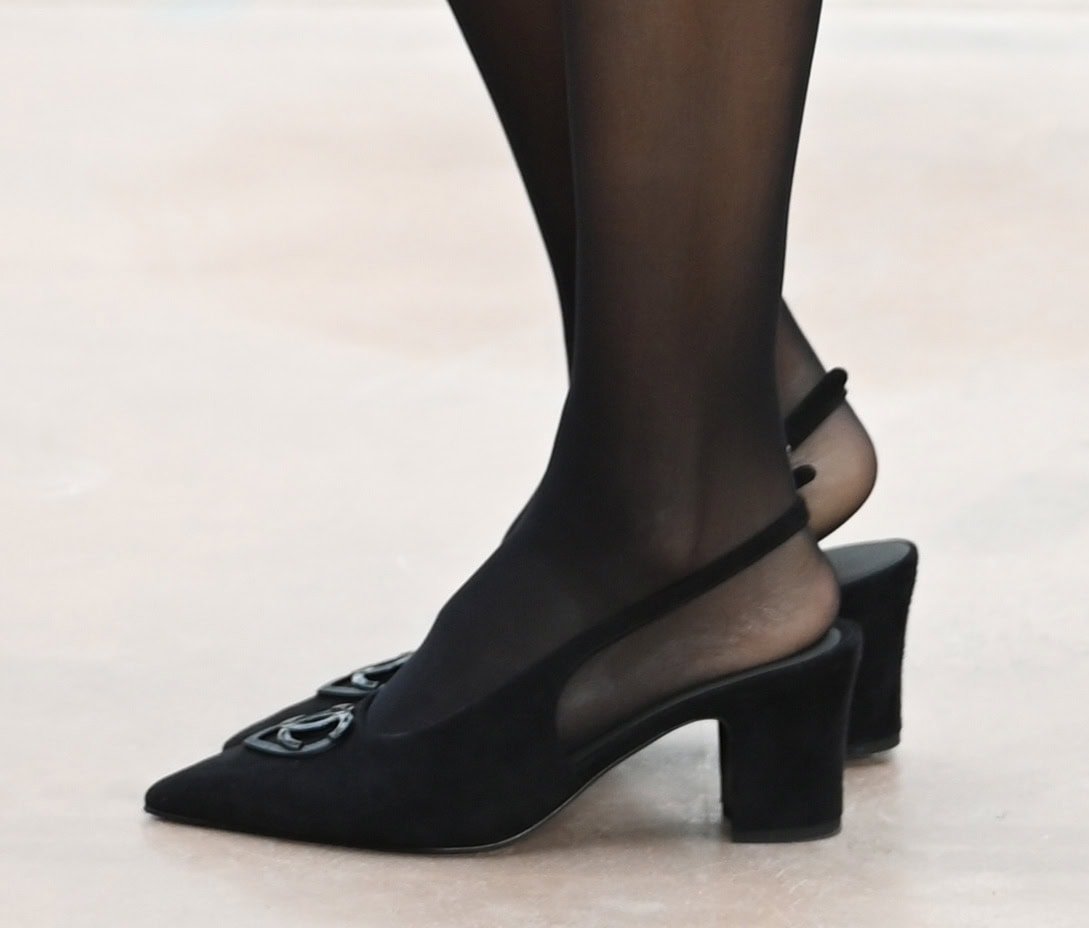 Jessica Alba wears striking black slingback pumps with Chanel's tonal interlocking CC logo and block heels