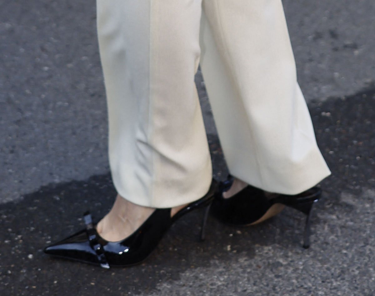 Olivia Palermo attends the Max Mara Milan Fashion Week show in Casadei's Superblade Juliet pumps, creating a polished and chic business look